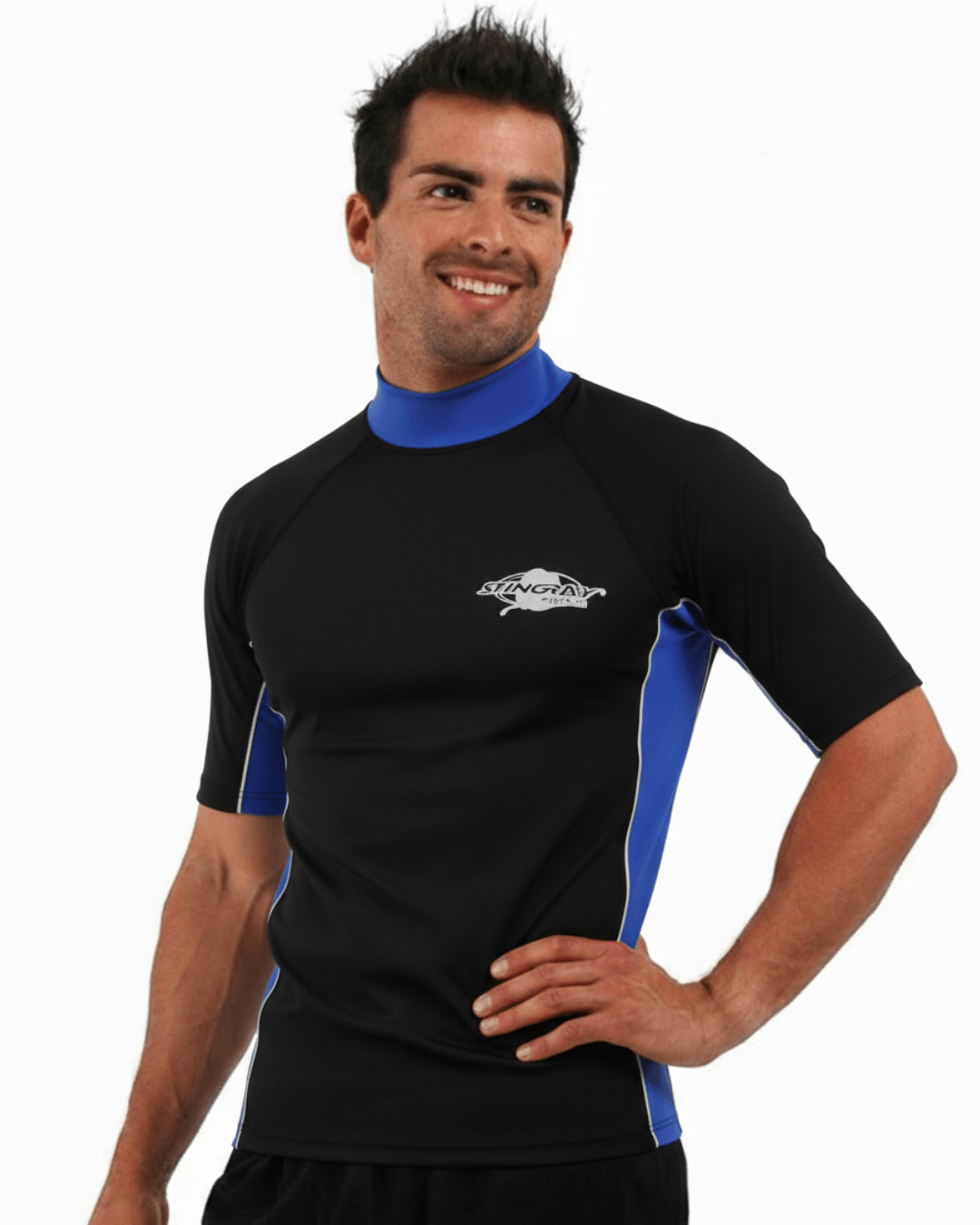 Man wearing black and blue Stingray adult short sleeve rash shirt with UPF 50+ sun protection, made from chlorine-resistant fabric for outdoor and water activities.
