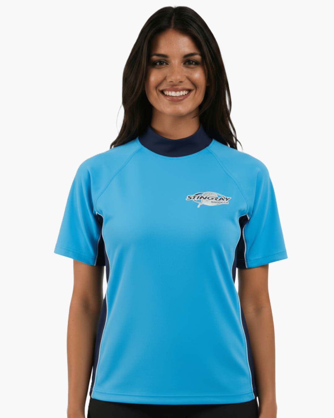 Woman wearing azure and navy Stingray adult short sleeve rash shirt with UPF 50+ sun protection, made from chlorine-resistant fabric for outdoor and water activities.