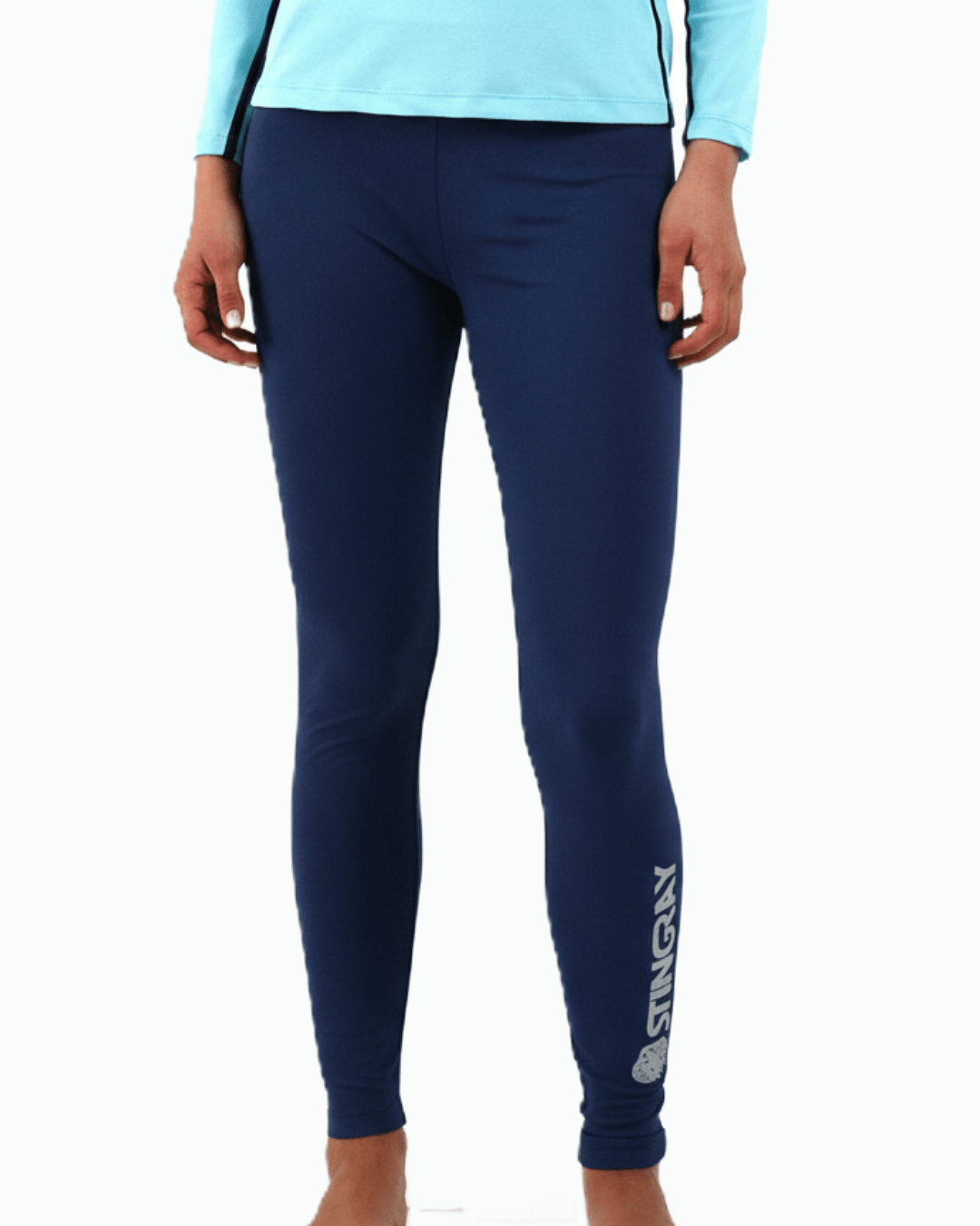 Woman wearing navy Stingray women's upf swim leggings with drawstring and inside pocket.