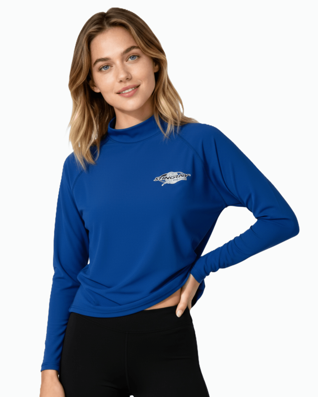 Woman wearing Stingray ocean blue unisex long sleeve rash shirt with UPF 50+ sun protection.
