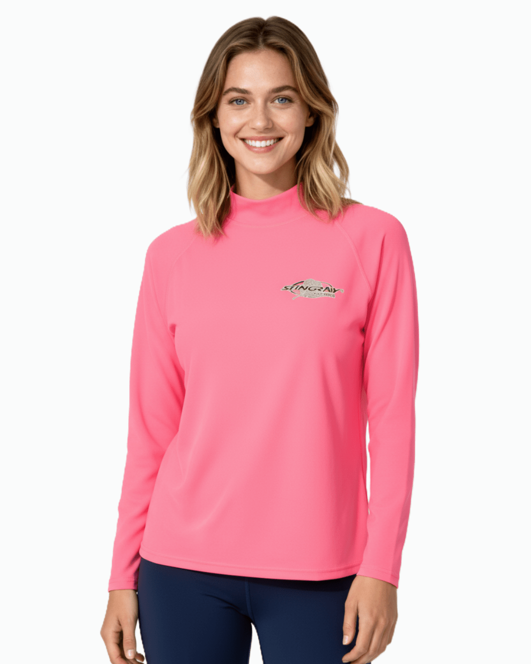 Woman wearing Stingray pink unisex long sleeve rash shirt with UPF 50+ sun protection.