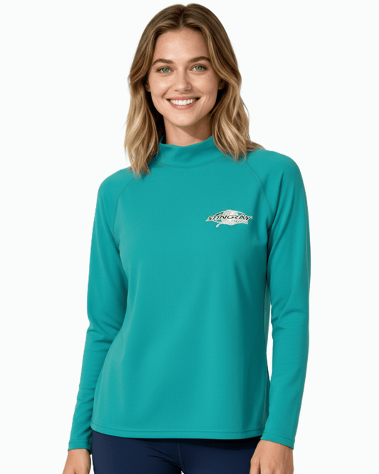 Woman wearing Stingray topaz/teal unisex long sleeve rash shirt with UPF 50+ sun protection.