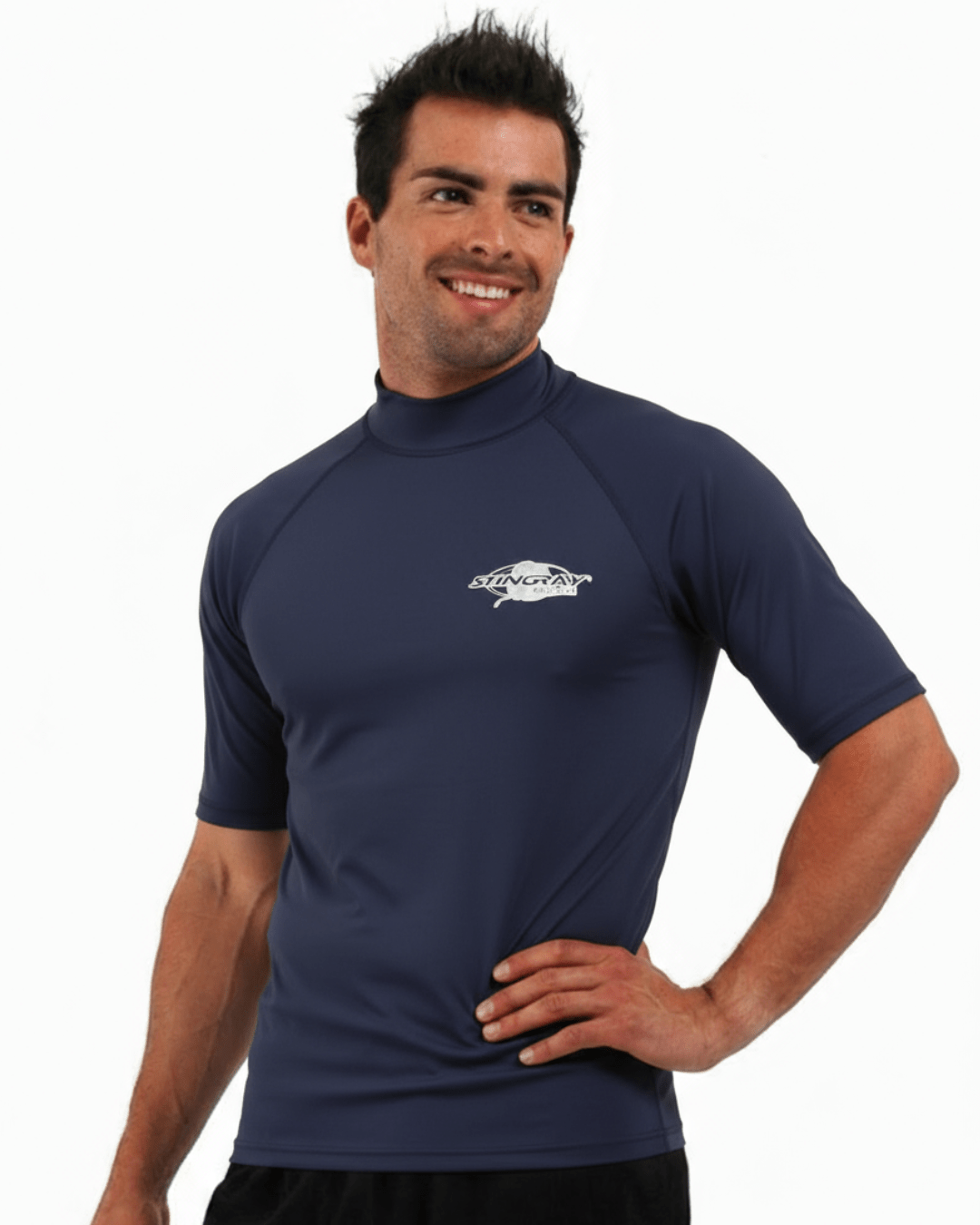 Man wearing navy Stingray adult short sleeve rash shirt with UPF 50+ sun protection, made from chlorine-resistant fabric for outdoor and water activities.
