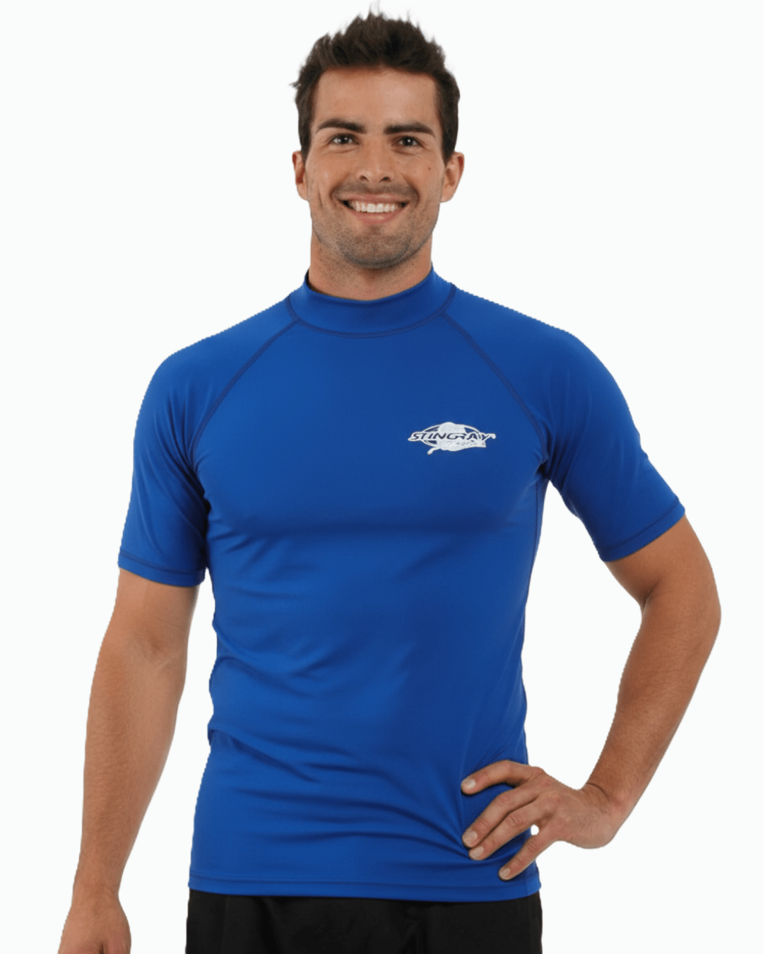 Man wearing ocean blue Stingray adult short sleeve rash shirt with UPF 50+ UV protection, made from chlorine-resistant fabric for outdoor and water activities.