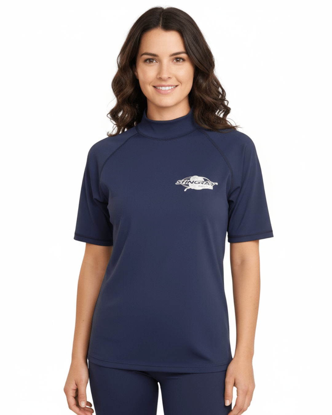 Woman wearing navy Stingray adult short sleeve rash shirt with UPF 50+ sun protection, made from chlorine-resistant fabric for outdoor and water activities.