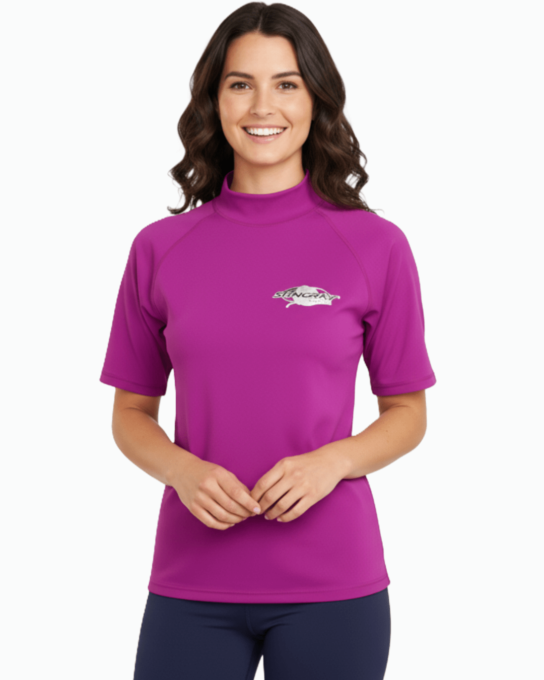 Woman wearing purple Stingray adult short sleeve rash shirt with UPF 50+ sun protection, made from chlorine-resistant fabric for outdoor and water activities.