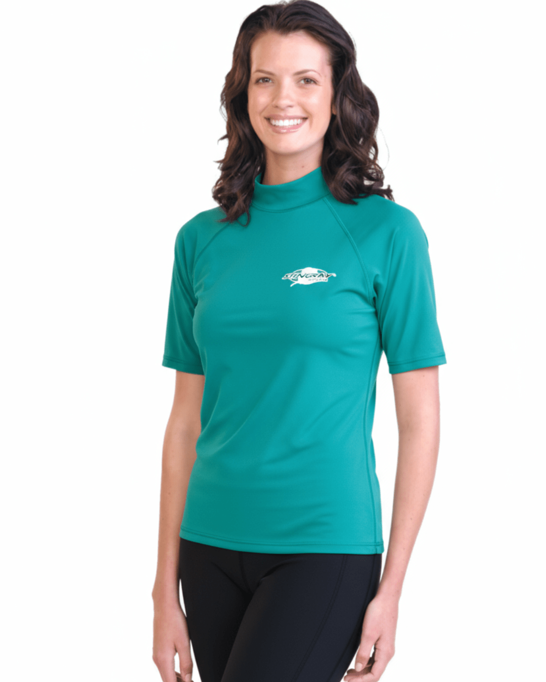 Woman wearing topaz Stingray adult short sleeve rash shirt with UPF 50+ sun protection, made from chlorine-resistant fabric for outdoor and water activities.