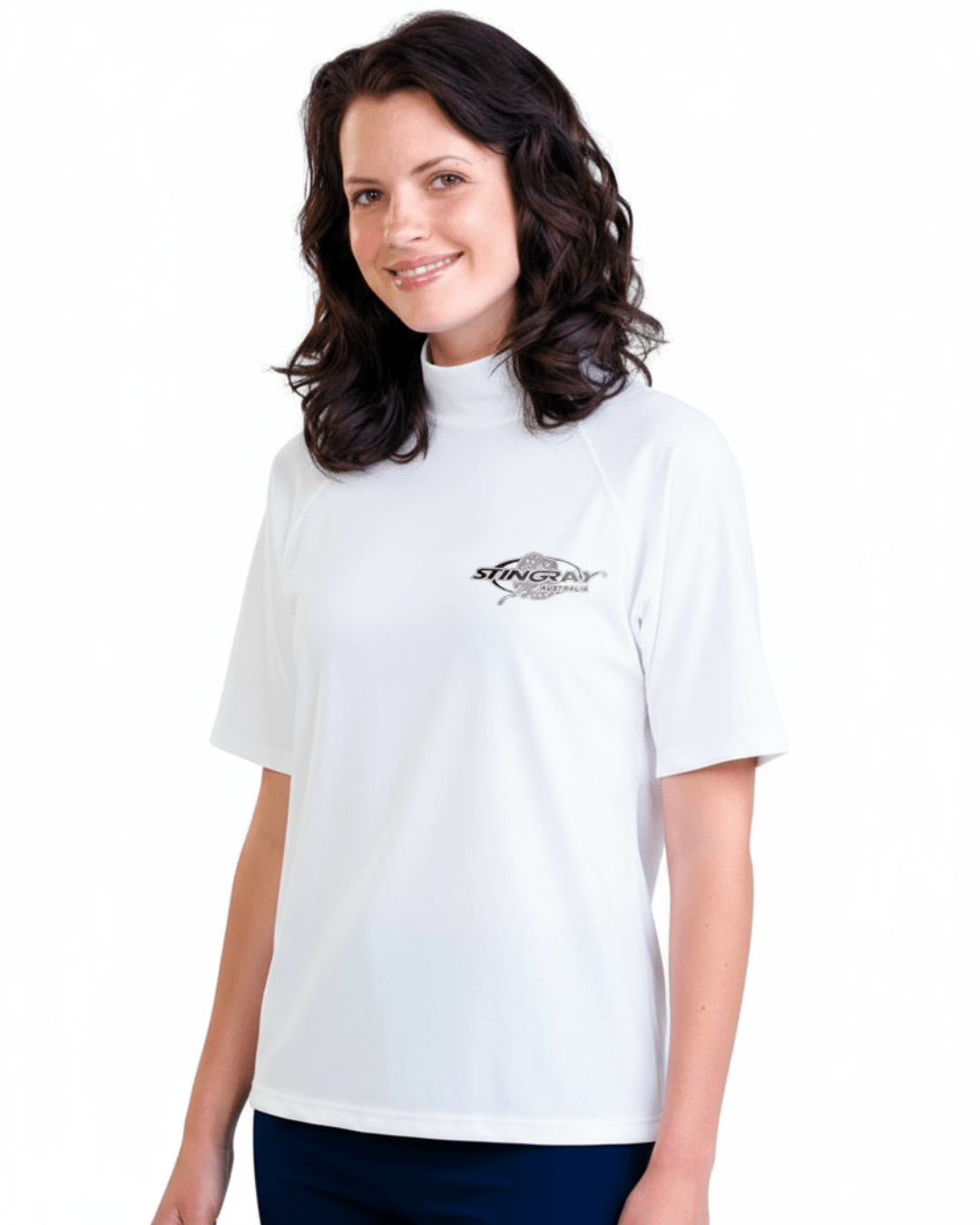 Woman wearing white Stingray adult short sleeve rash shirt with UPF 50+ sun protection, made from chlorine-resistant fabric for outdoor and water activities.