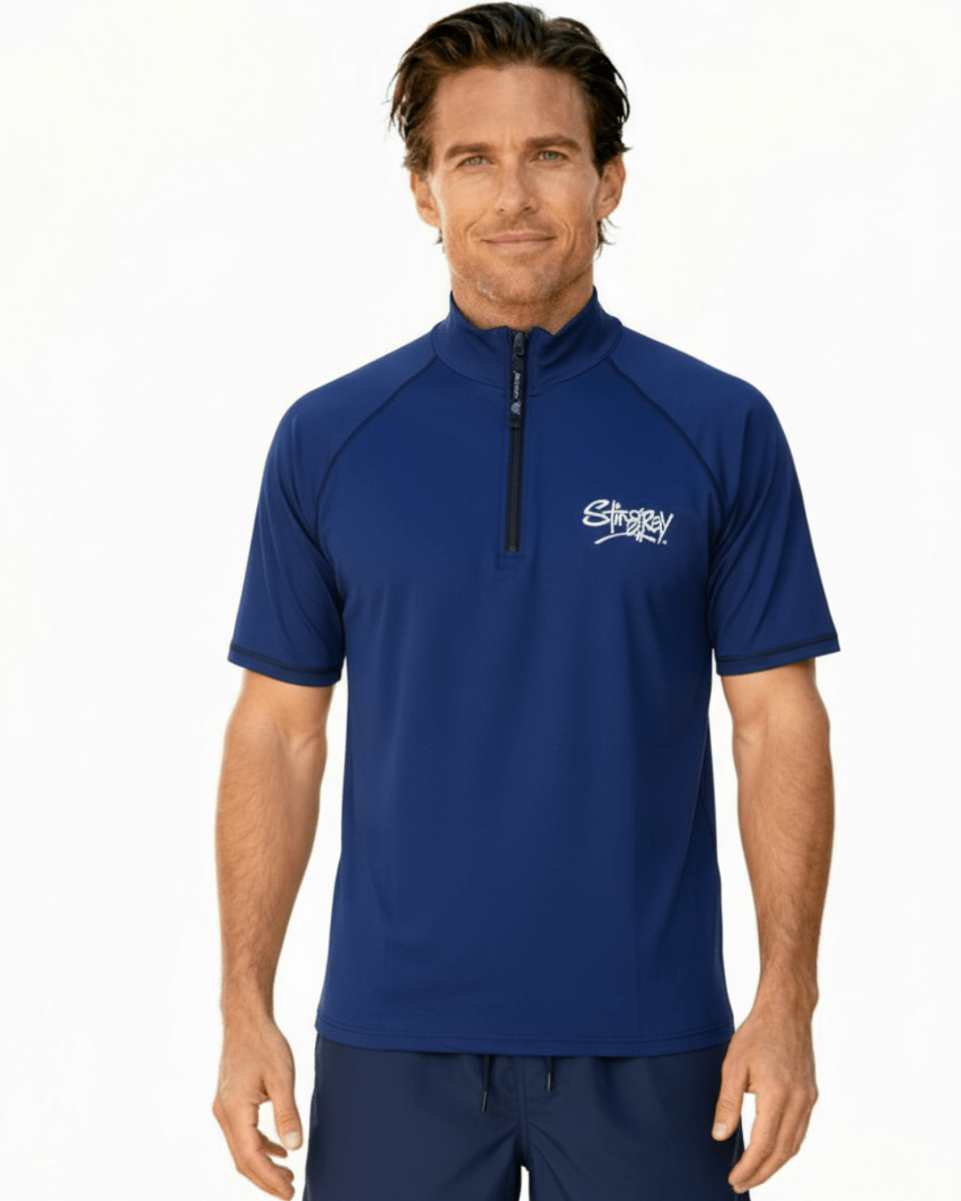 Man wearing navy Stingray unisex adult short sleeve quarter zip rash shirt with UPF 50+ sun protection.