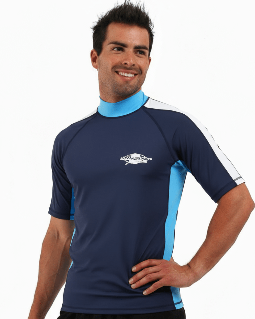 Man wearing navy, white and azure Stingray adult short sleeve rash shirt with UPF 50+ sun protection, made from chlorine-resistant fabric for outdoor and water activities.