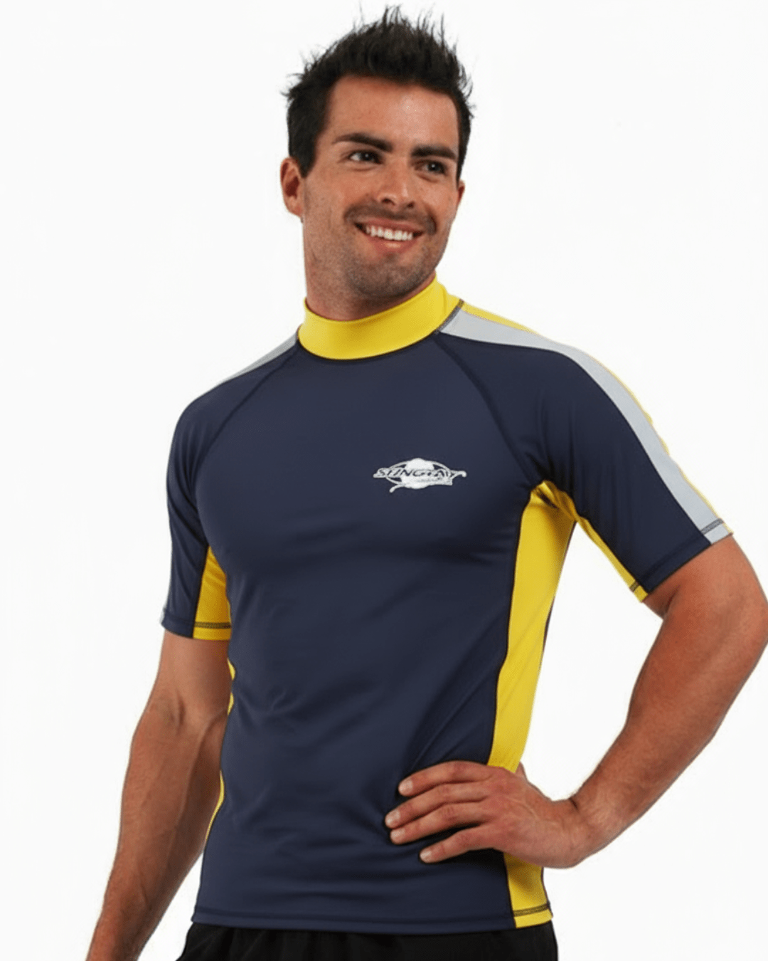 Man wearing navy, white and yellow Stingray adult short sleeve rash shirt with UPF 50+ sun protection, made from chlorine-resistant fabric for outdoor and water activities.