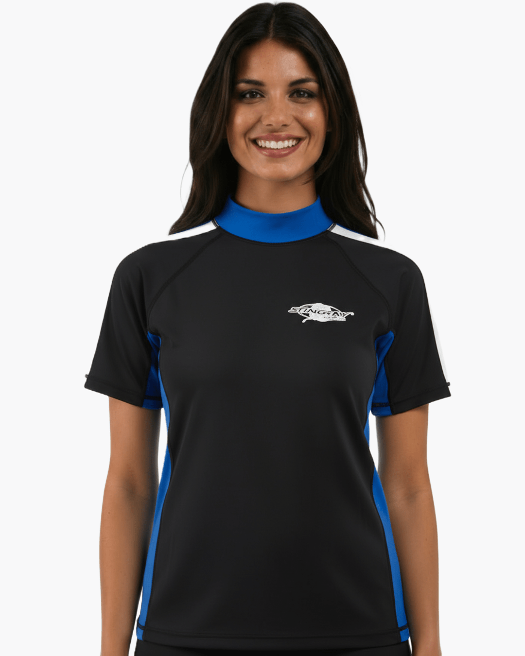 Woman wearing black, white and blue Stingray adult short sleeve rash shirt with UPF 50+ sun protection, made from chlorine-resistant fabric for outdoor and water activities.