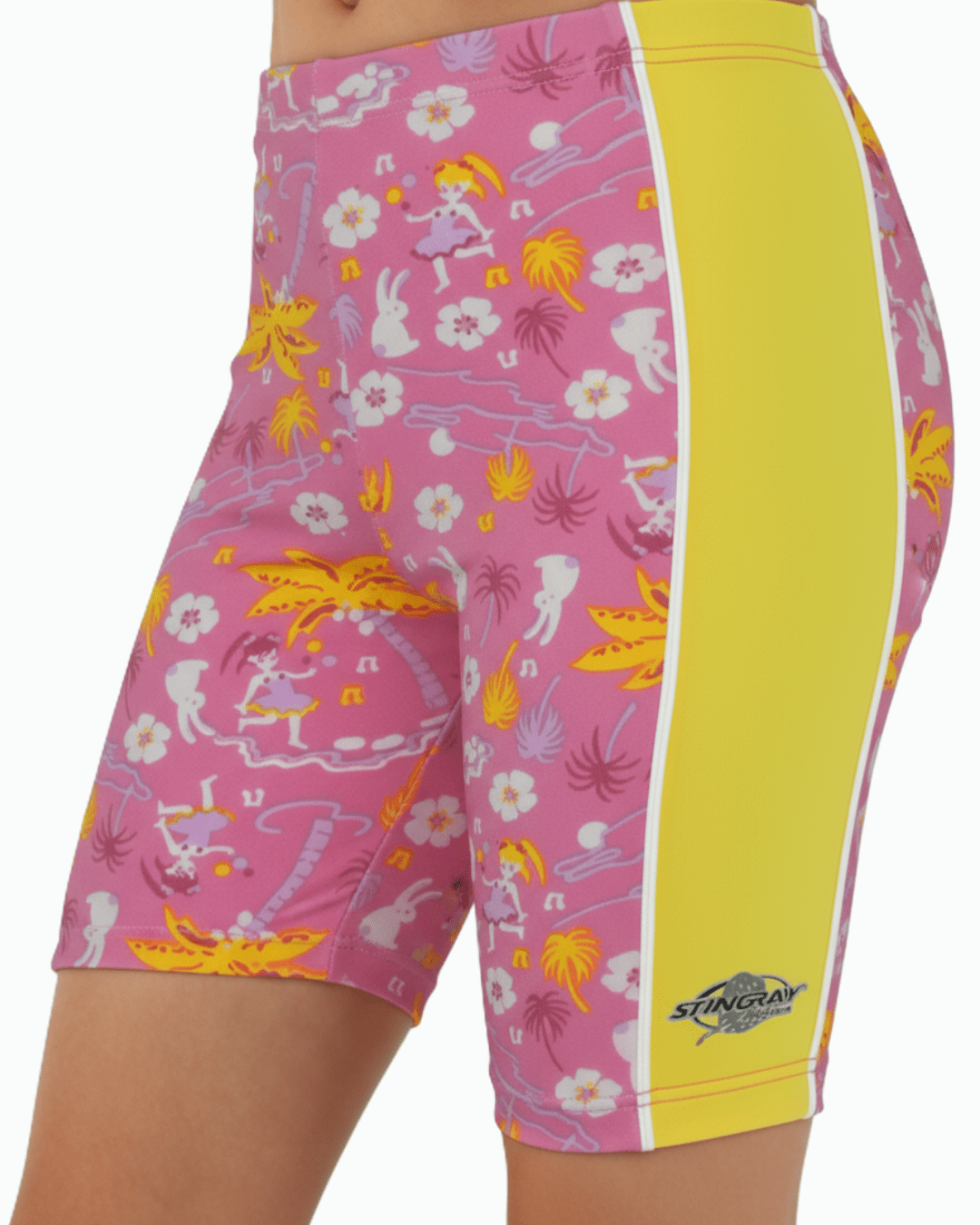 Toddler wearing pink and yellow upf swim shorts in a Hawaii style with a Stingray logo on a white background