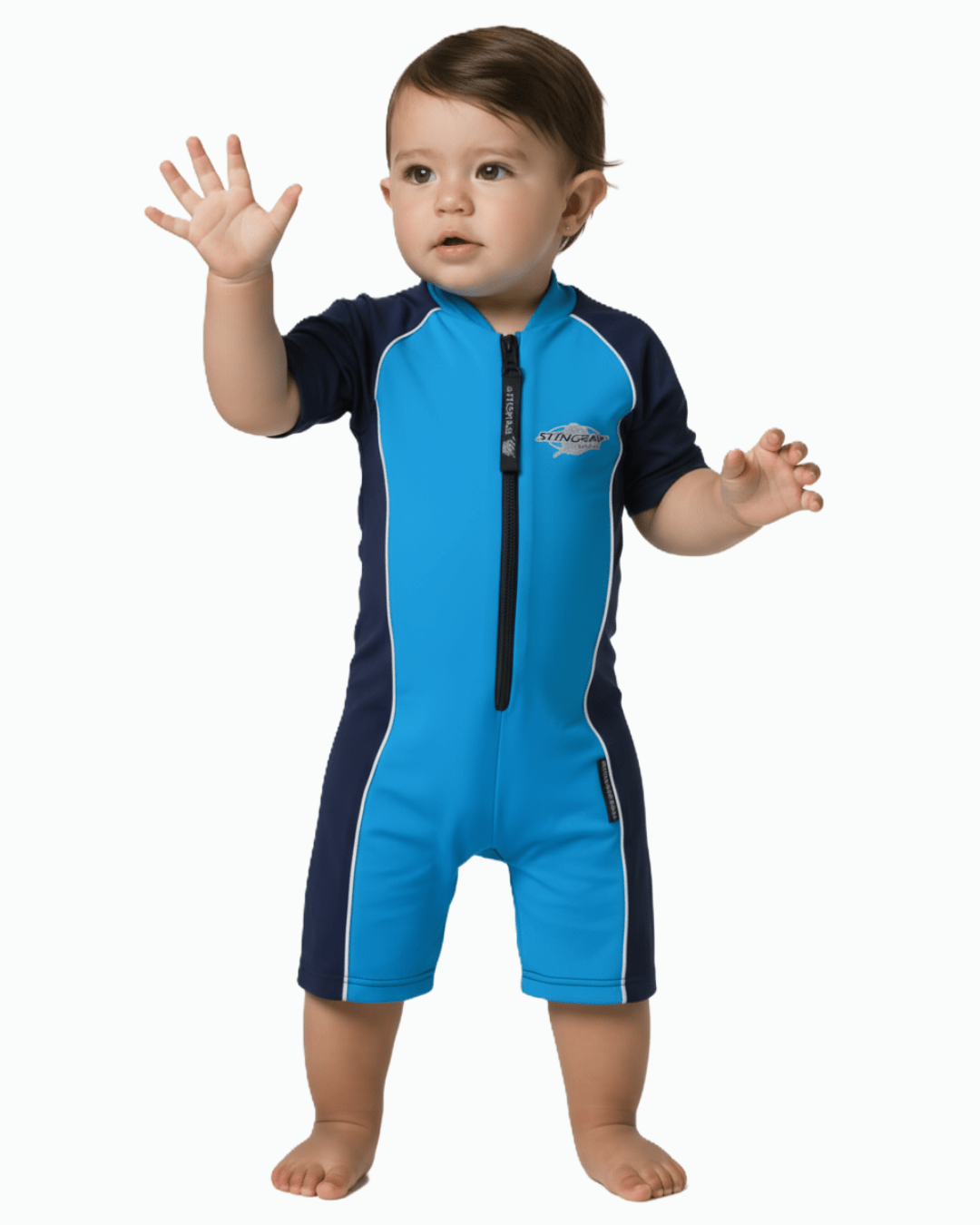 Toddler wearing a azure and navy UPF swimsuit on a white background