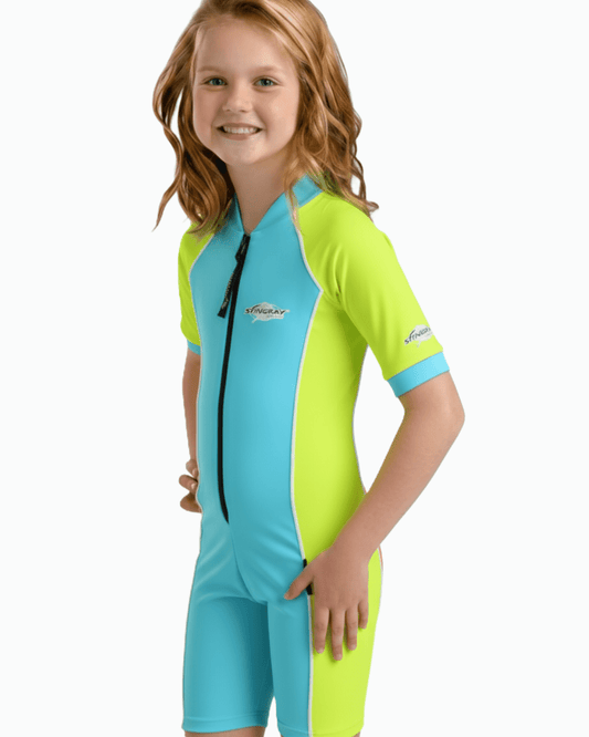 Child wearing a green and blue UPF 50+ sun protection swimsuit with a visible Stingray logo on a white background
