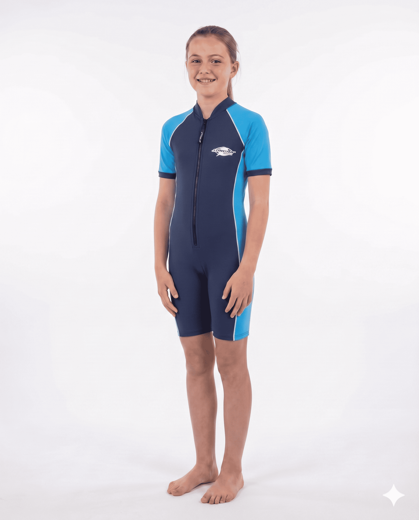 12 year old girl wearing a blue and navy uv protection swimsuit on a white background