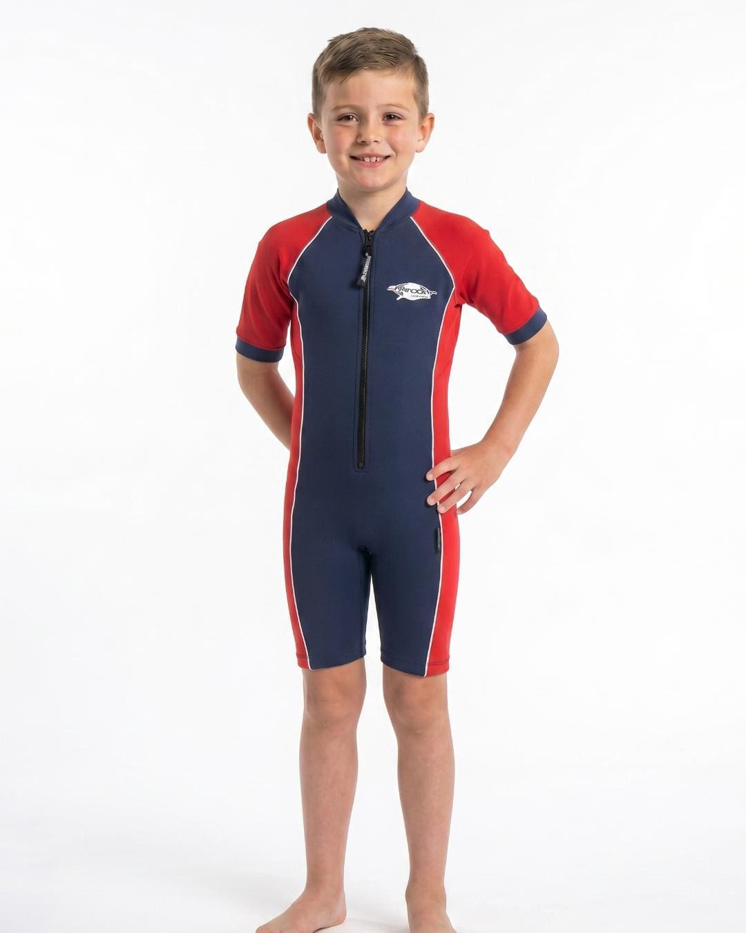 8 year old boy wearing a navy and red UPF 50+ short sleeve sunsuit on a white background