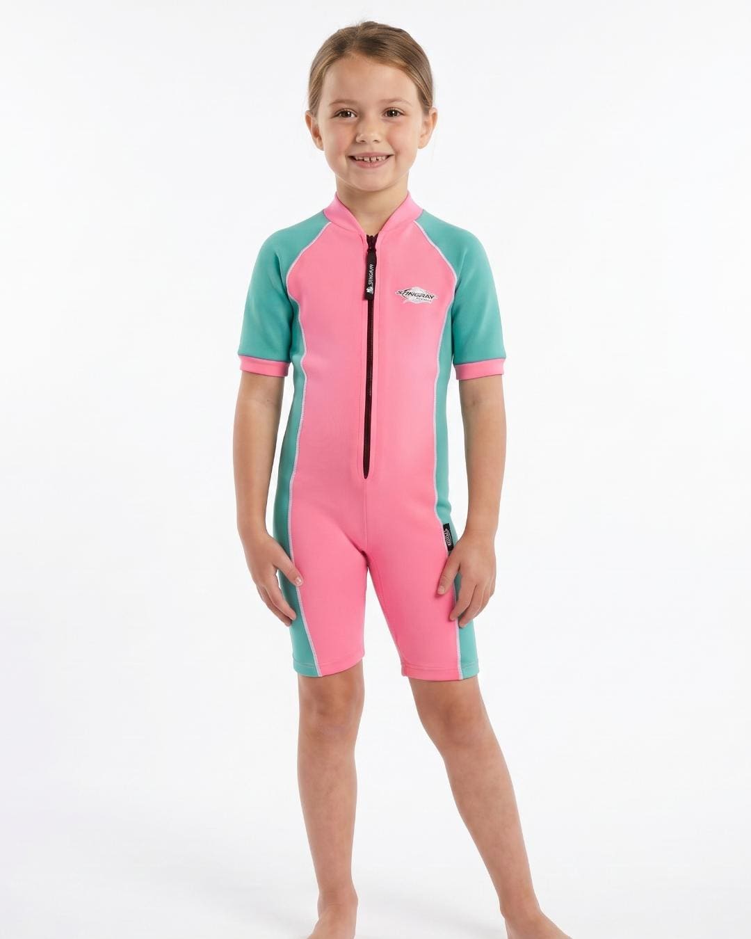 6 year old girl wearing a pink and turquoise short sleeve swimsuit 