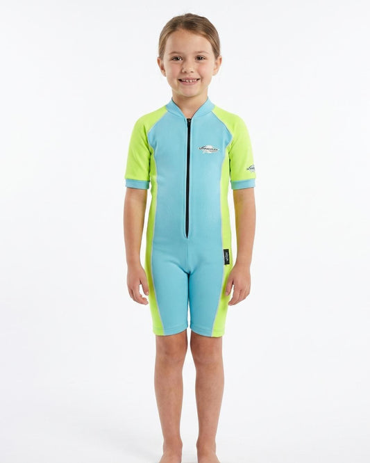 Girl wearing a blue and yellow uv swimsuit with short sleeves on a white background