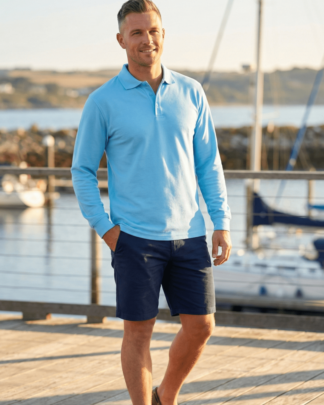 Man wearing long sleeve light blue UPF polo shirt