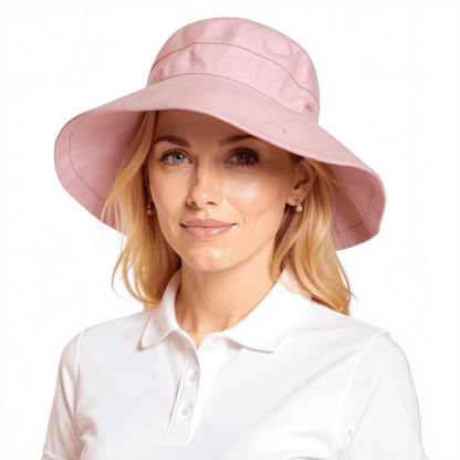 Side on model wearing light pink Stingray Women's Sun Hat with 4-inch wide brim and UPF 50+ sun protection. Fully-lined 100% cotton wide-brimmed sun hat with adjustable interior drawstring.