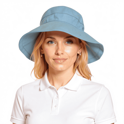 Model wearing light blue Stingray Women's Sun Hat with 4-inch wide brim and UPF 50+ sun protection. Fully-lined 100% cotton wide-brimmed sun hat with adjustable interior drawstring.