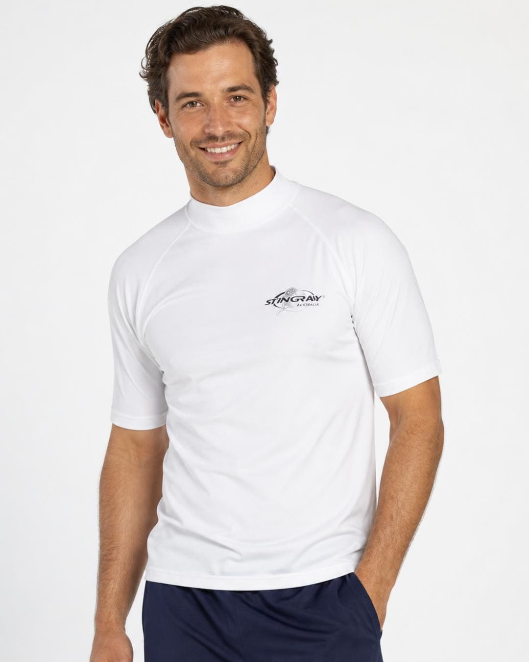 Man wearing white UV rash shirt UPF 50+ in a white studio