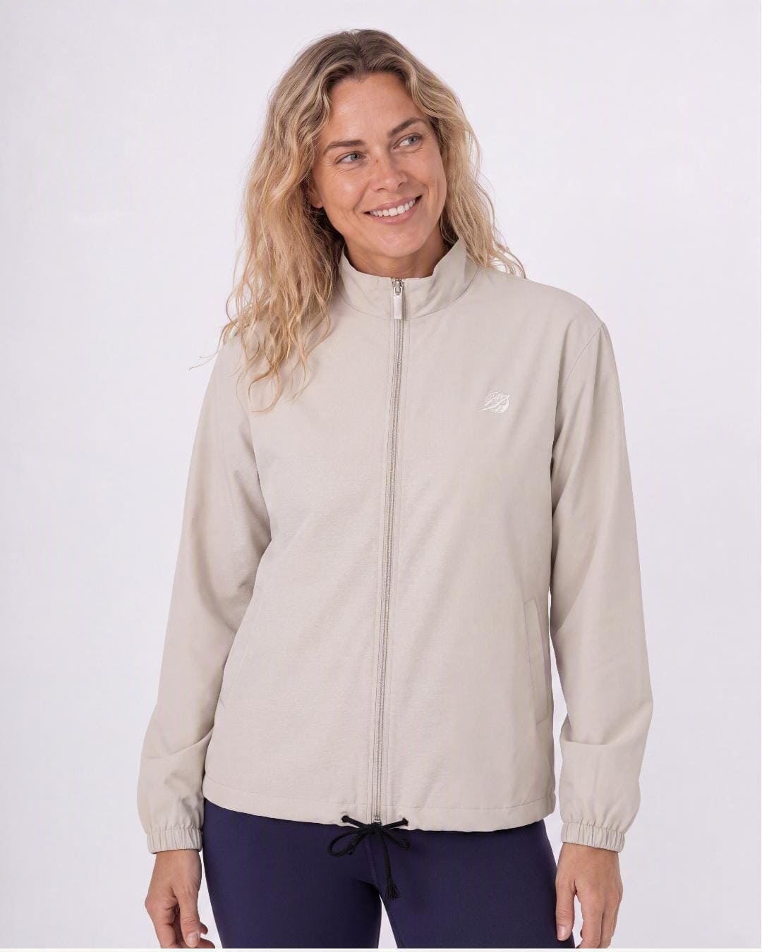 Woman modelling the Stingray UV vented jacket UPF 50+ in bone, in a studio