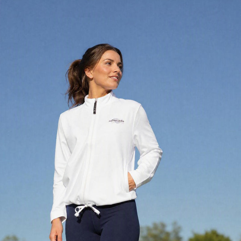 Woman wearing a white UV jacket UPF 50+ in the sun