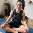 Woman wearing UV protection shorts whilst stretching