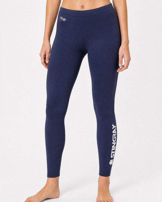 Woman wearing UV swim leggings/tights UPF 50+ in navy