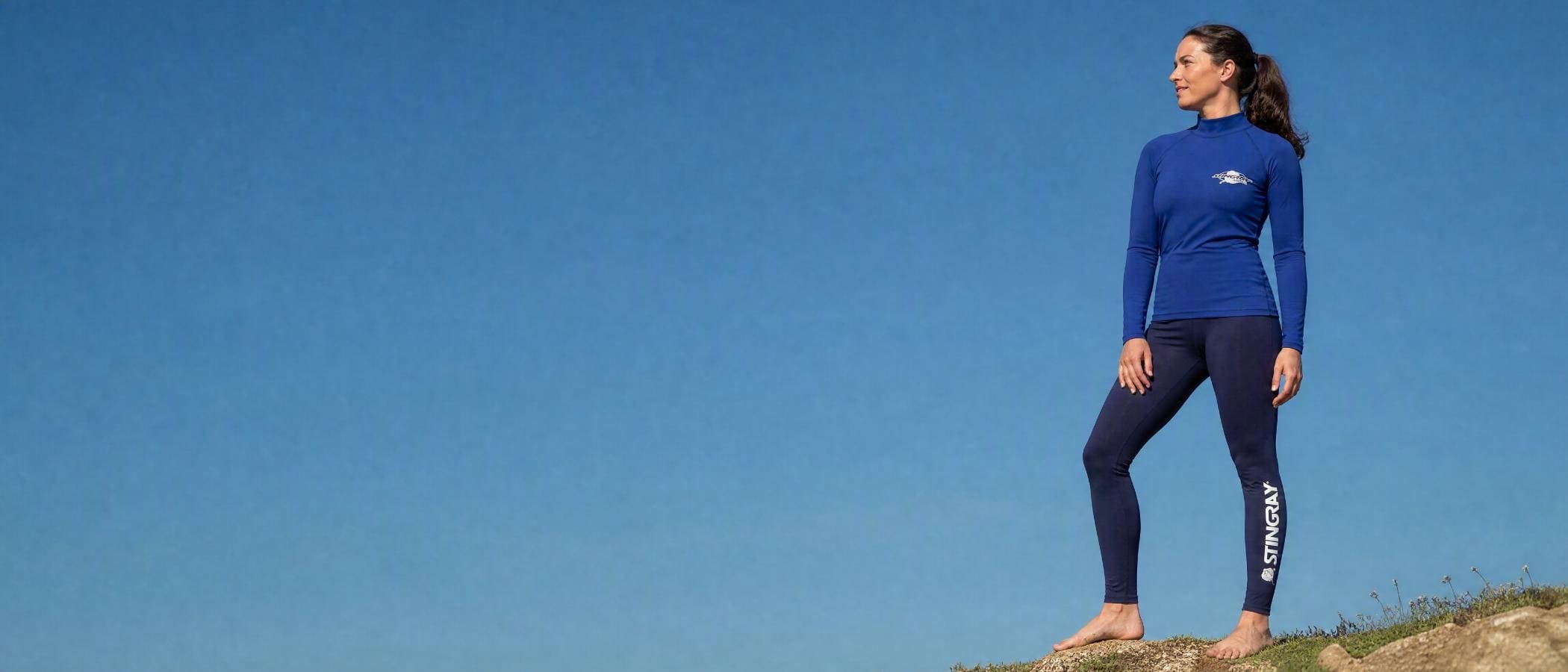 Woman wearing UV swim shirt UPF 50+ in the sun