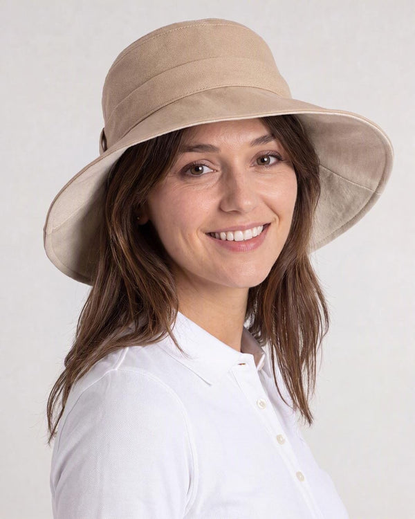 Womens Reversible UV Wide Brim Sun Hat UPF 50+ Desert Sand on Outside and Oatmeal on inside  Ribbon Desert Sand - Close-up on model