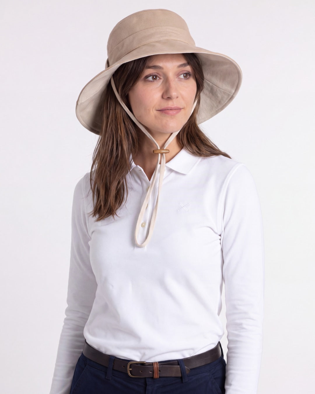 Womens Reversible UV Wide Brim Sun Hat UPF 50+ Desert Sand on Outside and Oatmeal on inside  Ribbon Desert Sand with chin strap - On model