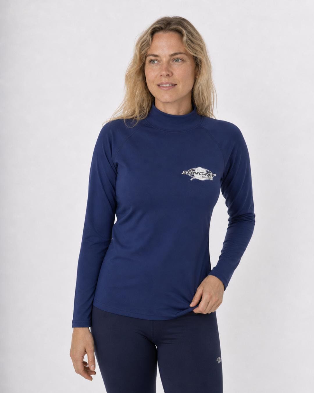 Woman wearing a navy long-sleeve UV swim shirt UPF 50+ on a white background
