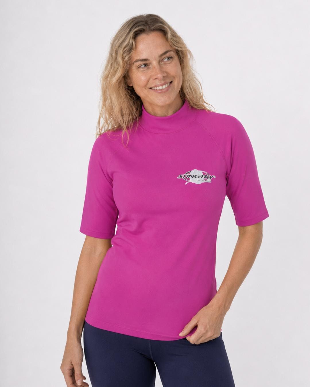 Woman wearing a purple UV swim shirt UPF 50+ on a white background